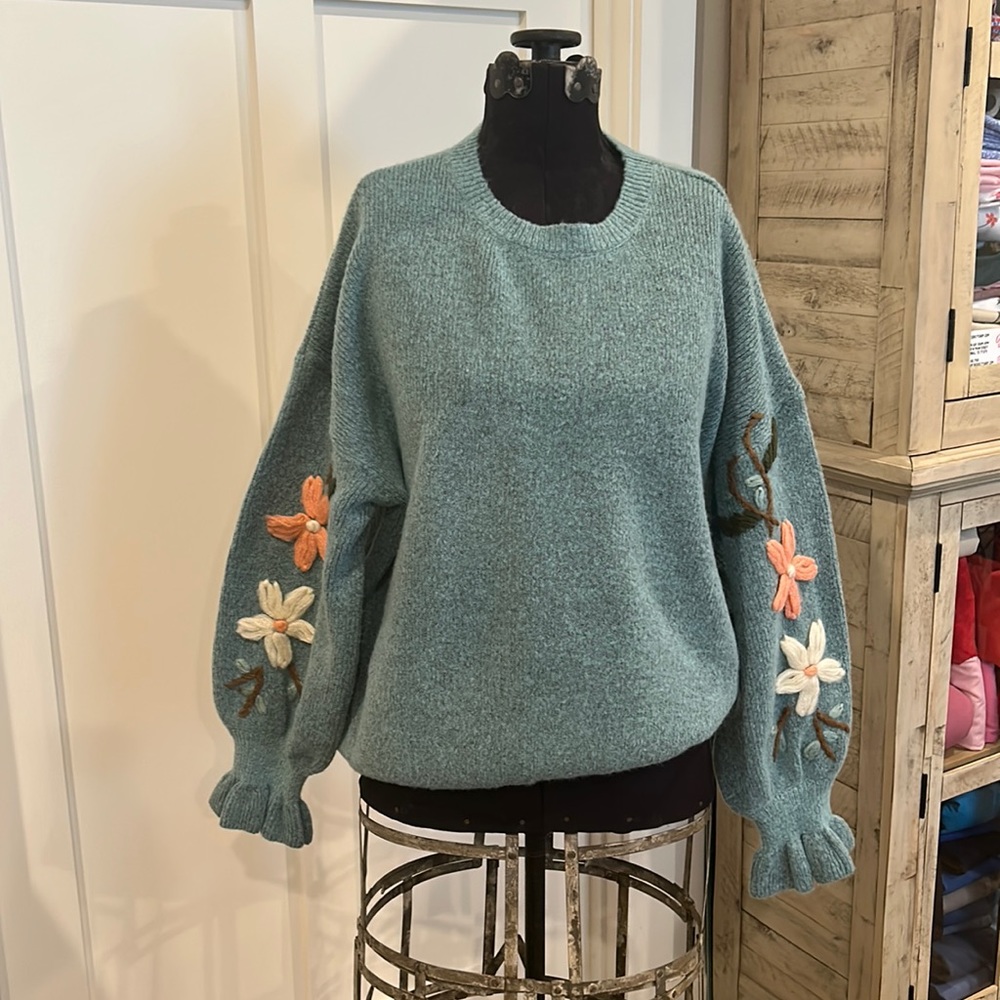 Super cute oversized sweater with embroidery detail on both sleeves